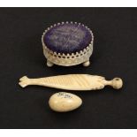 Three French bone sewing items, comprising a fish form needle case, one glass eye only present,