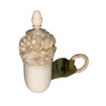 A fine 19th Century carved ivory acorn form tape measure, the top deeply carved with flowers, leaves