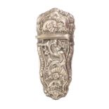 A late 18th Century silver etui, unmarked, the case decorated with flowers, leaves, shells and