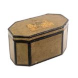A Georgian paper covered box in the form of a tea caddy, of elongated octagonal form covered in