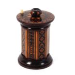 A Tunbridge ware rosewood go to bed, the circular base incorporating a striker, the octagonal body