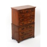 An attractive walnut miniature chest on chest, circa 1920, the lower section on ogee bracket feet