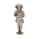 A continental silver figural standing needle case, in the form of a young man in elaborate