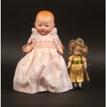 Two late  19th Century/early 20th Century dolls, comprising a bisque head example marked ‘A M