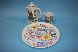 A Norwegian 'Saga' teapot and mug and a Poole pottery plate (3)