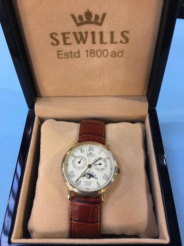 A boxed Sewills Millennium Calendar Moonphase watch, in 9ct gold case