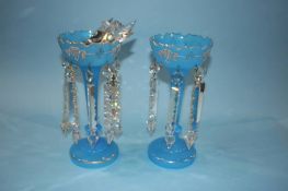 A pair of Victorian blue lustres with clear glass drops, 29cm high