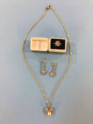A 9ct gold and silver ring, a pair of earrings, pendant and chains