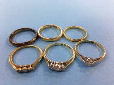 Four 18ct gold rings, 9.9grams, a ring with obscure marks and a plated ring (6)