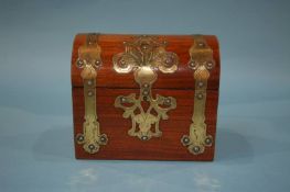 A walnut brass and dome top jewellery casket