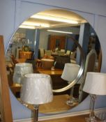 A large circular mirror, 110cm diameter