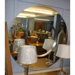 A large circular mirror, 110cm diameter