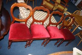 A set of four Victorian balloon back dining chairs