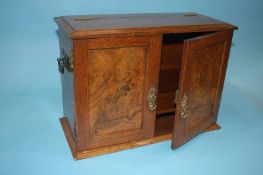 An oak and walnut Smoker's cabinet