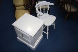 A cream painted cabinet and chair