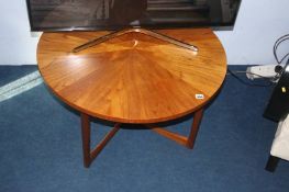 A teak McIntosh style circular table with segmented top