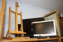 Various TVs and an easel