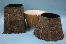 Two feather lamp shades and a beadwork shade (3)
