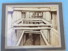 A collection of 8 early 20th century photographs showing the Construction of a dry dock, stamped