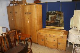 An oak three piece bedroom suite