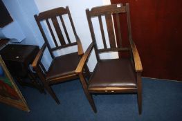A pair of oak carver armchairs