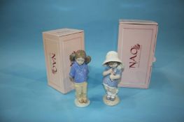 Two Nao figures, boxed