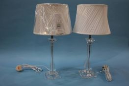 A pair of as new table lamps