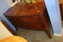 A bow fronted four drawer sideboard
