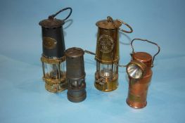 A Mills Miners lamp, an Eccles and two other lamps (4)