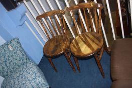 A pair of stick back chairs