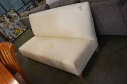 A cream three seater sofa