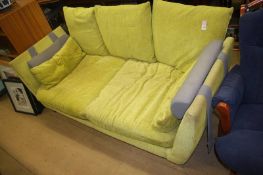 A lime green and grey three seater sofa