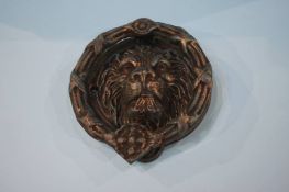 Lion mask door knocker