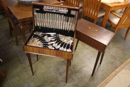 A canteen of cutlery and a canteen stand