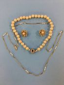 A seed pearl and yellow metal necklace, a pair of earrings and a pearl necklace