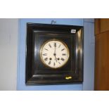 Ebonised wall clock with 8 day movement, enamelled dial, by W. H. Tooke a Paris