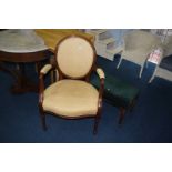 Walnut framed armchair and a stool