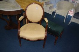 Walnut framed armchair and a stool