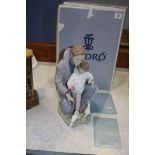 Lladro figure of a man and child feeding pigeons