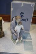 Lladro figure of a man and child feeding pigeons