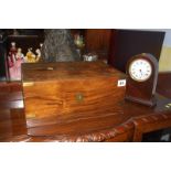 Walnut writing slope and a clock