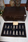 An oak canteen containing sixteen pairs of silver plated salt and pepper pots