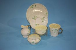 A collection of Belleek pottery, black and green marks