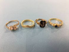 An 18ct gold ring and an 18ct gold wishbone diamond ring and two dress rings, total weight 11.6g