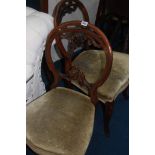 A set of four Victorian walnut dining room chairs