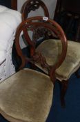 A set of four Victorian walnut dining room chairs