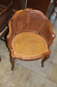 A walnut framed bergere chair