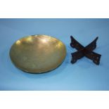 A shallow engraved circular Chinese brass bowl, 26cm diameter