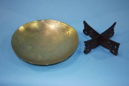A shallow engraved circular Chinese brass bowl, 26cm diameter