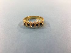 An 18ct gold ring, mounted with diamonds and sapphires, size 'K', 3.3g